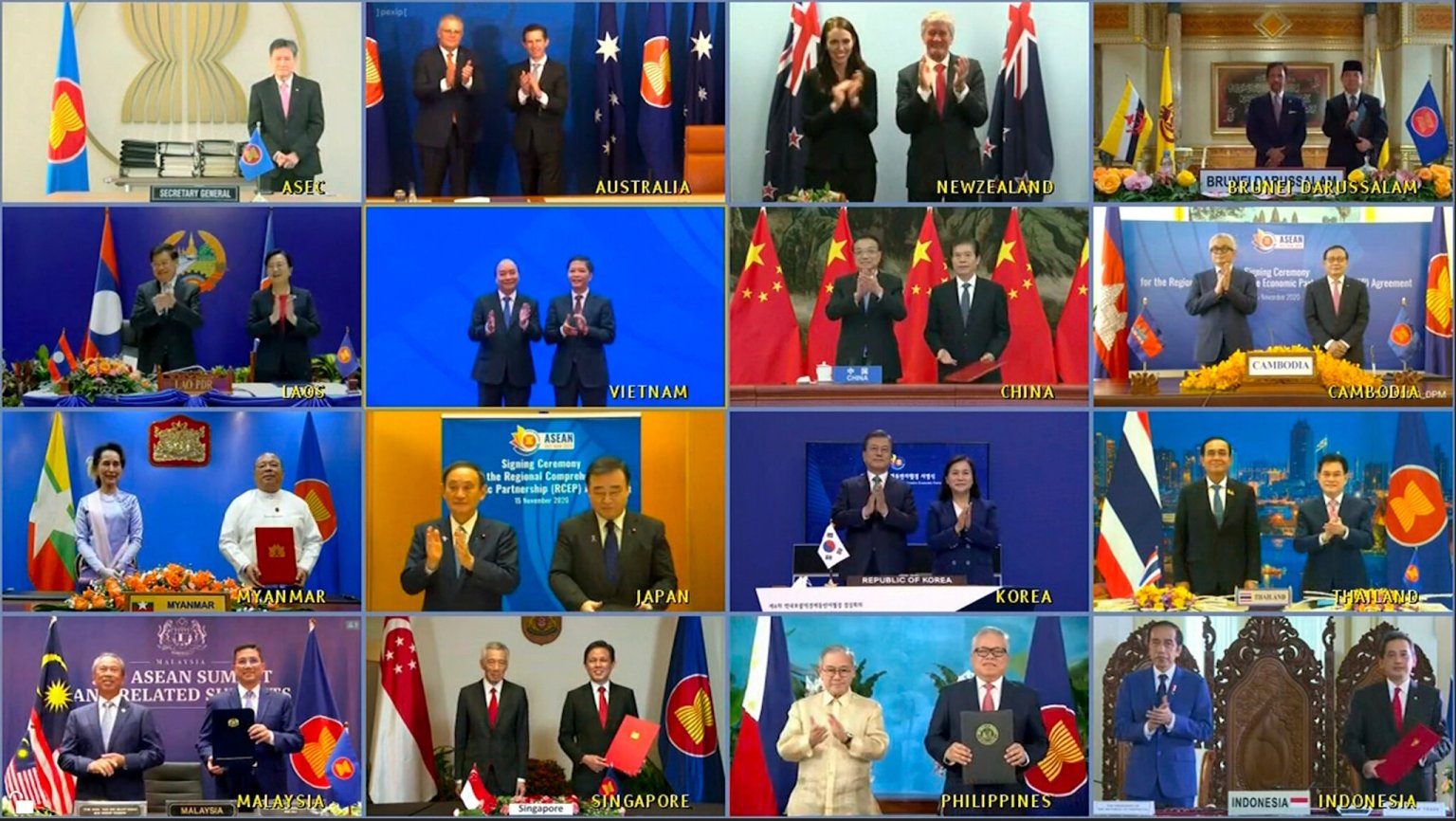 A grid of 16 video conference screens showing leaders and ministers from various Asia-Pacific nations, including China, Japan, Australia, and ASEAN members, during the official signing ceremony of the RCEP trade agreement. Many are holding signed documents or applauding.